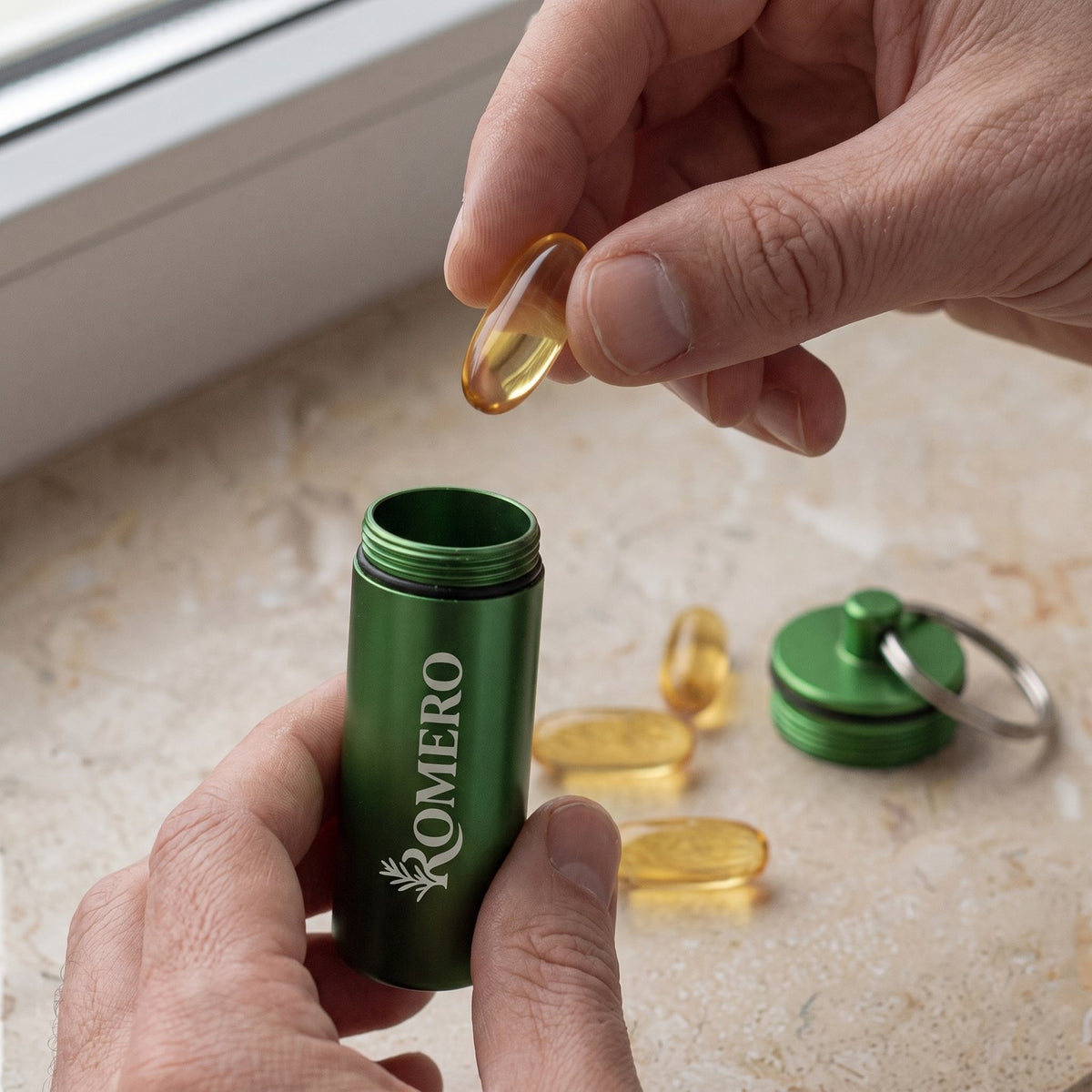ROMERO on-the-go softgel case with oregano oil softgels